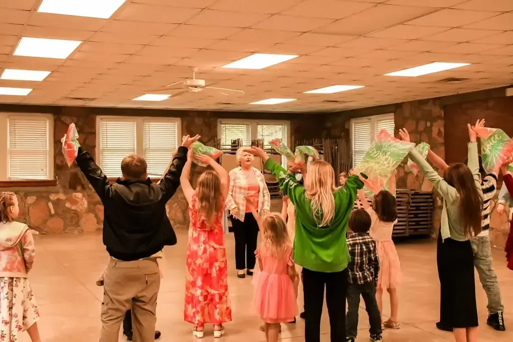Children worshiping with banners in kids church